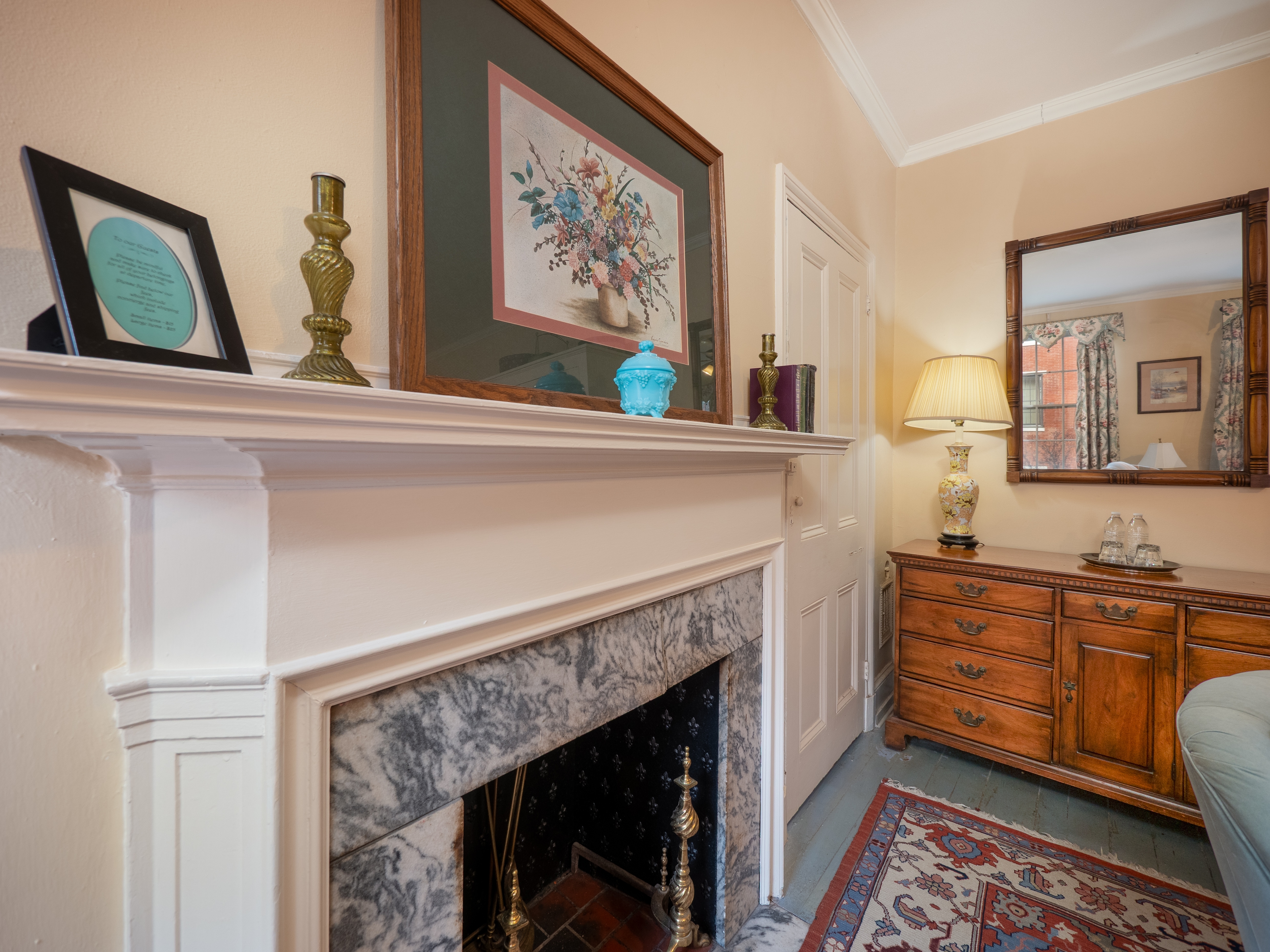 Showcase of the decorative fireplace and antique dresser.