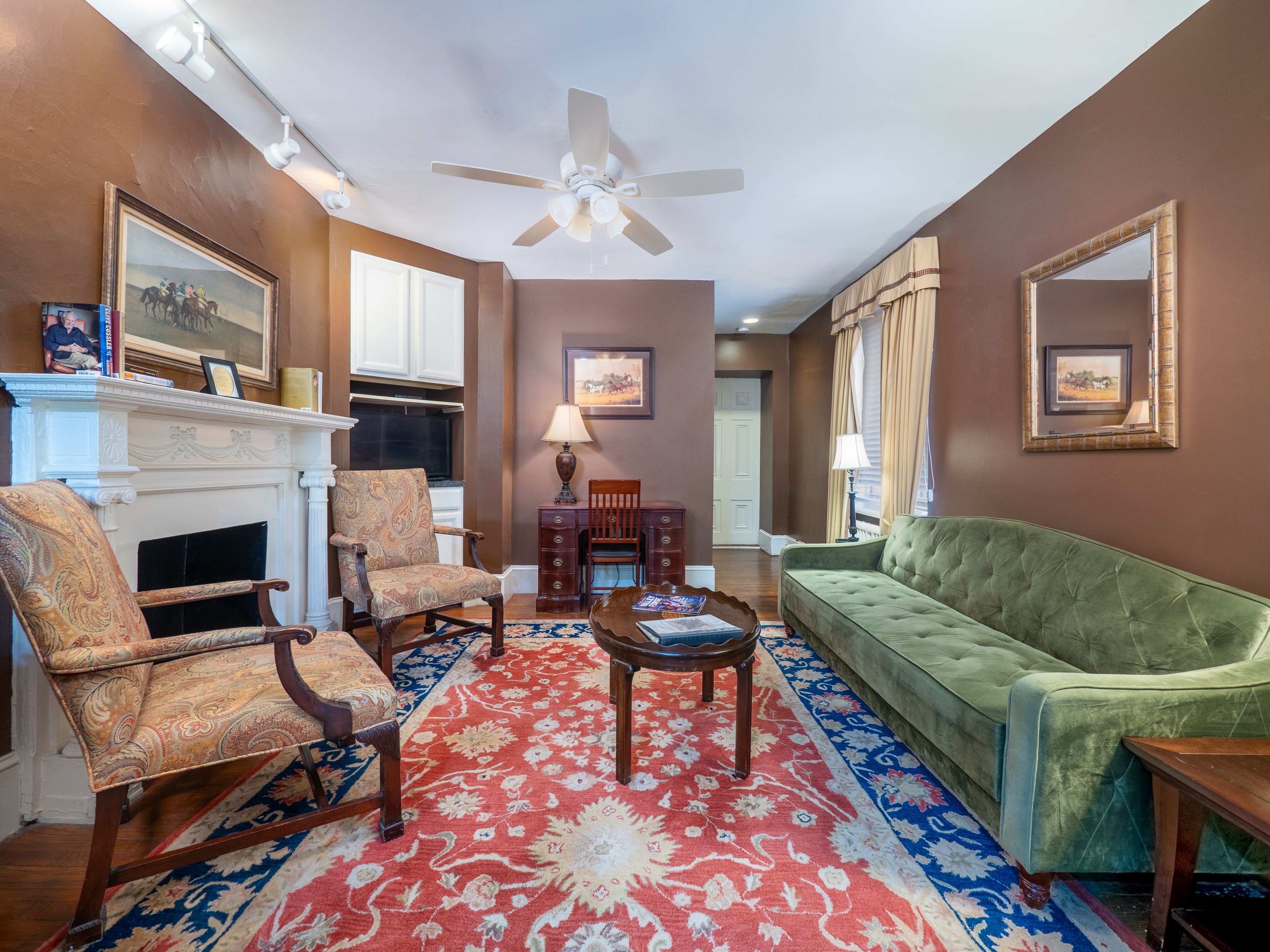 Alternative shot of the living room showing hallway to bedroom area.