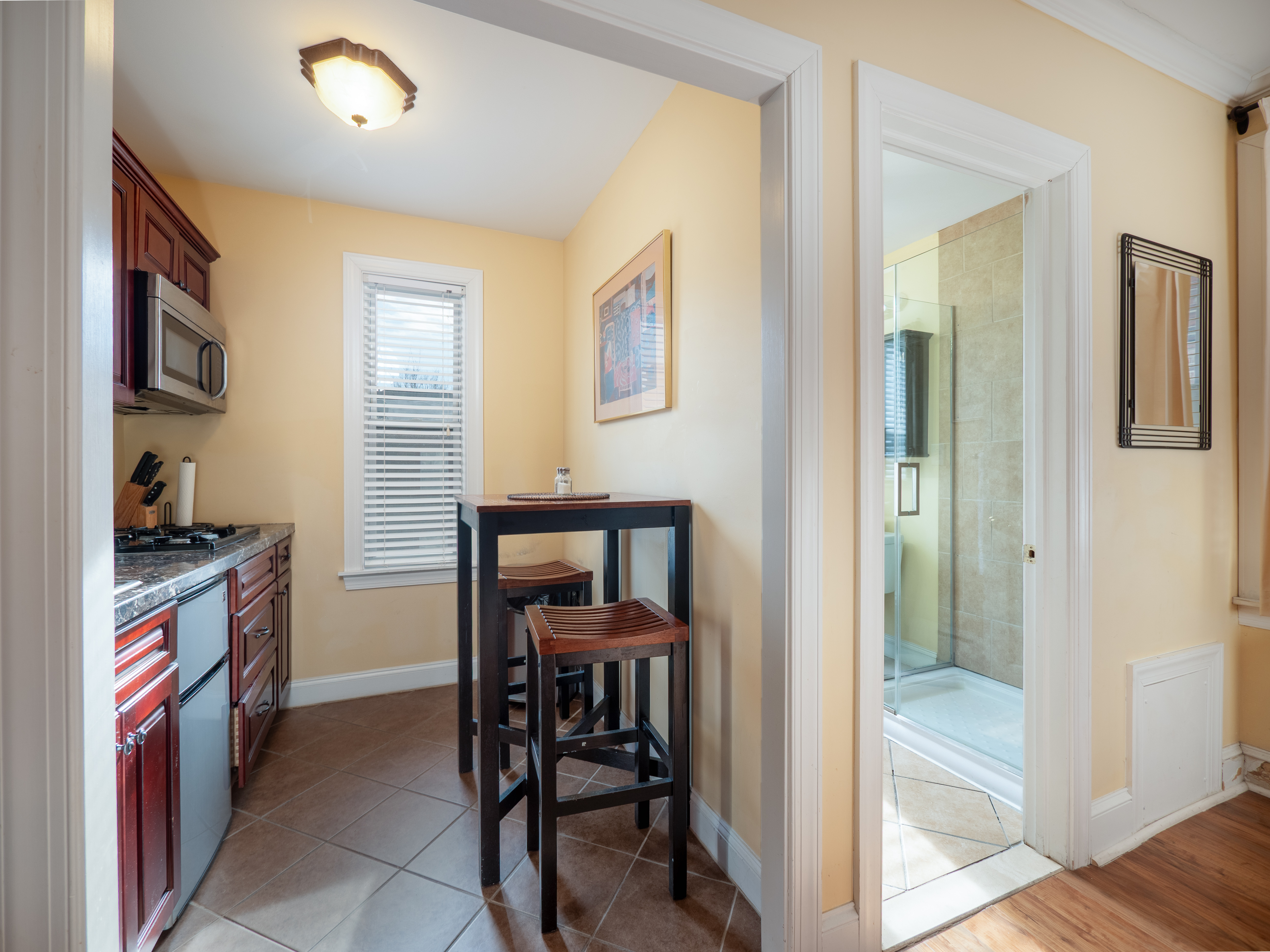 Kitchenette with view of the bathroom entrance to the right.