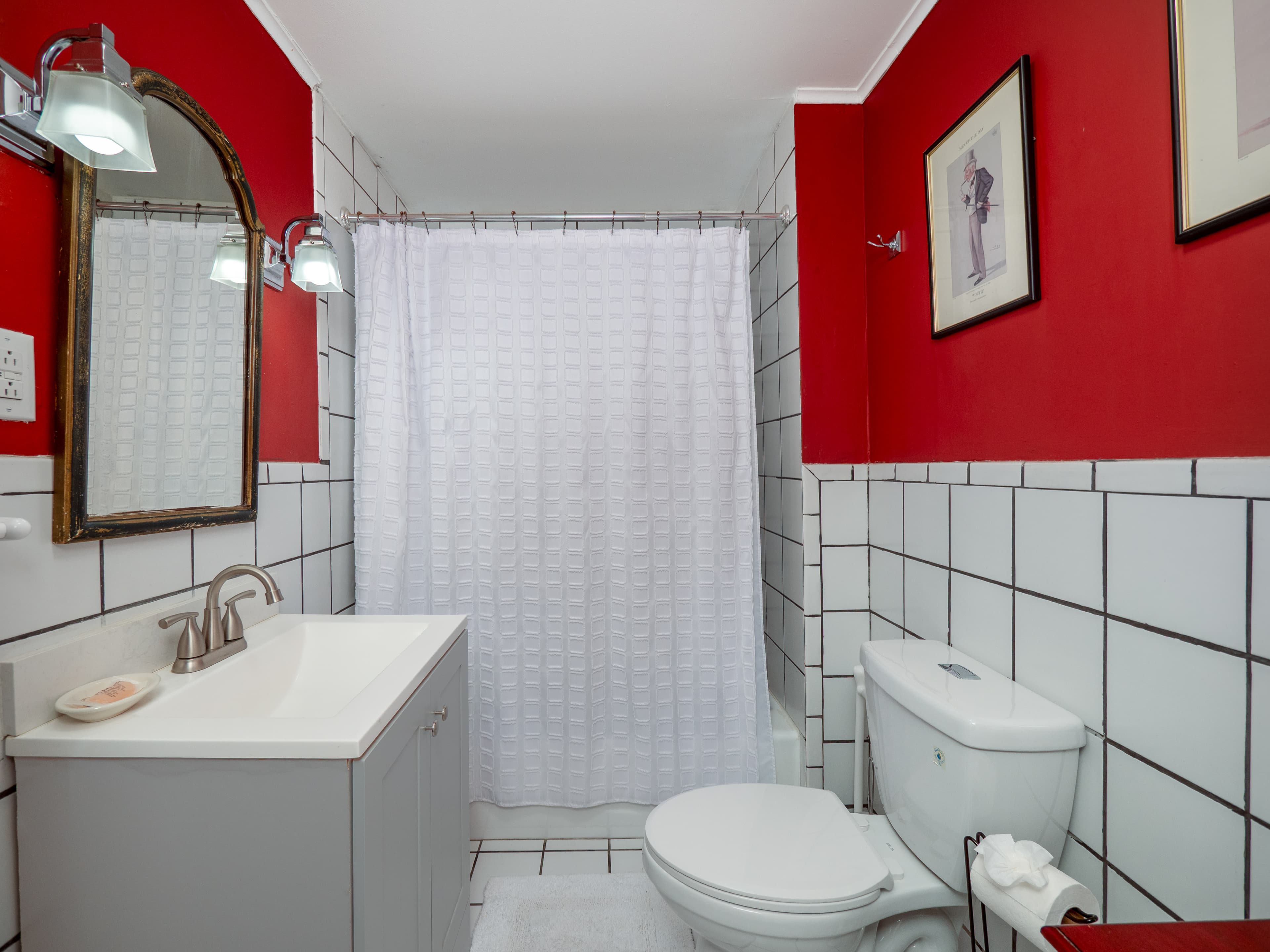 Retro full bathroom with half tile walls.