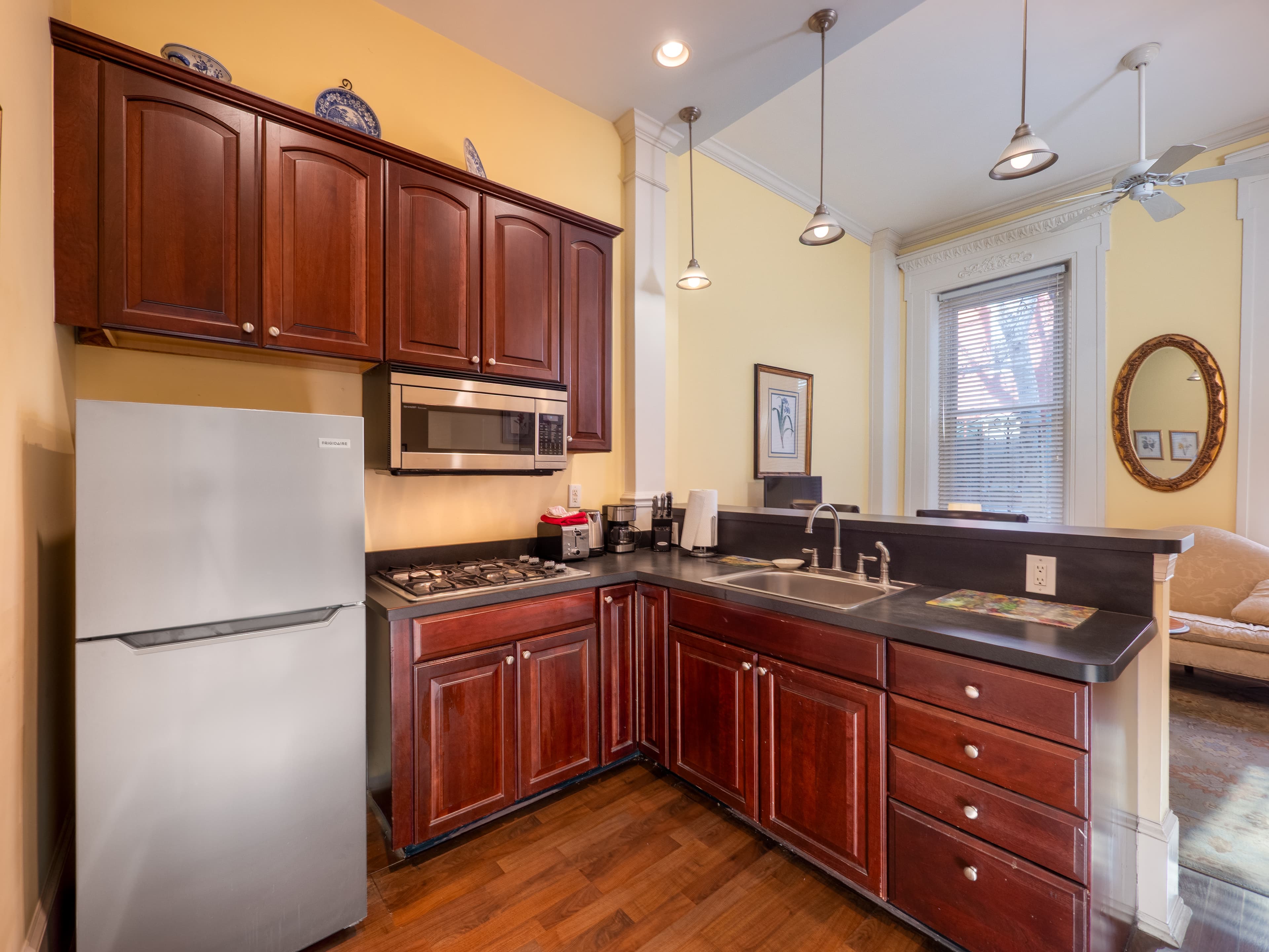 Close up of the full kitchen showing the natural light provided by the windows.