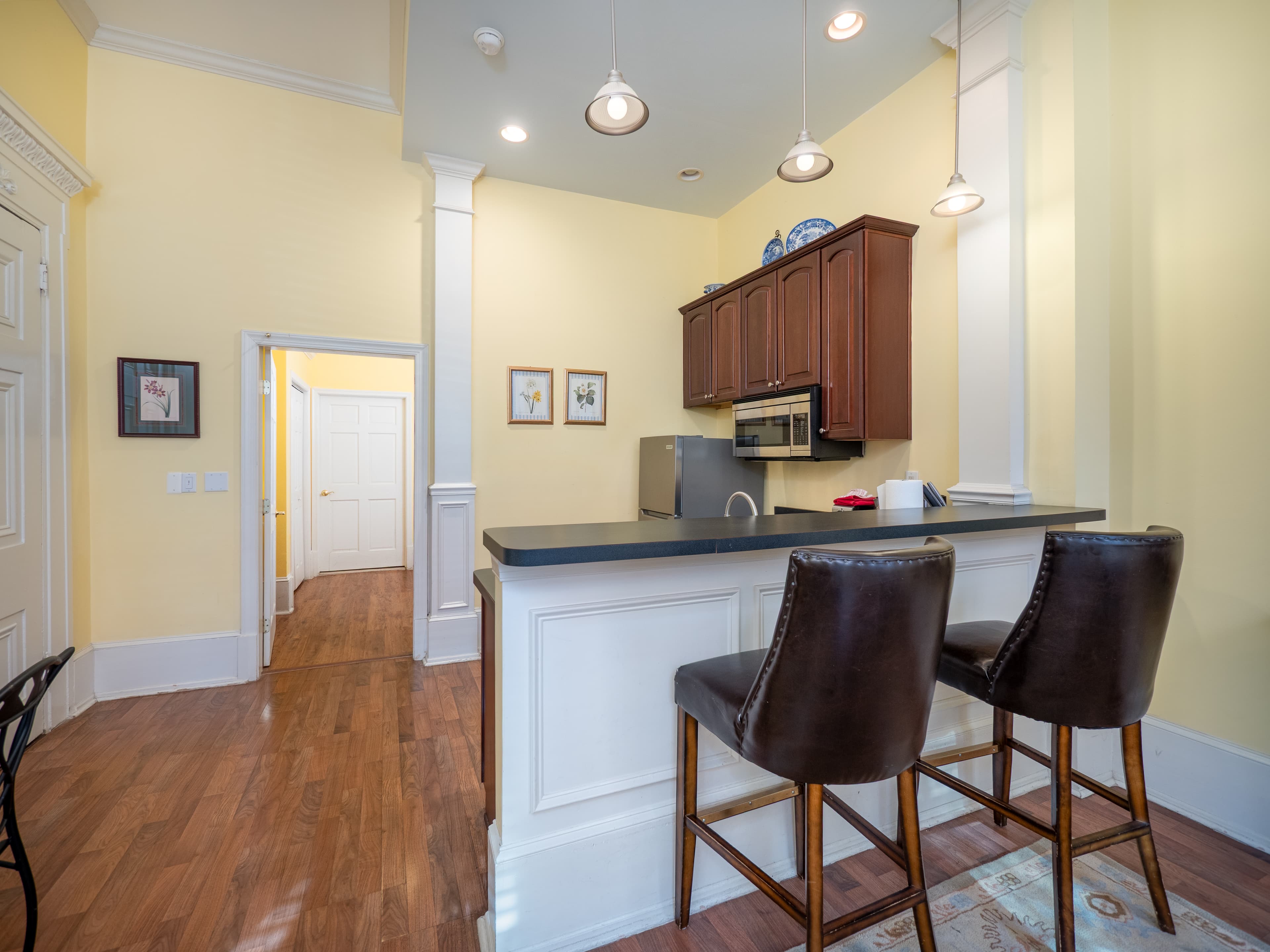 Close up of the bar chair seating facing the kitchen.