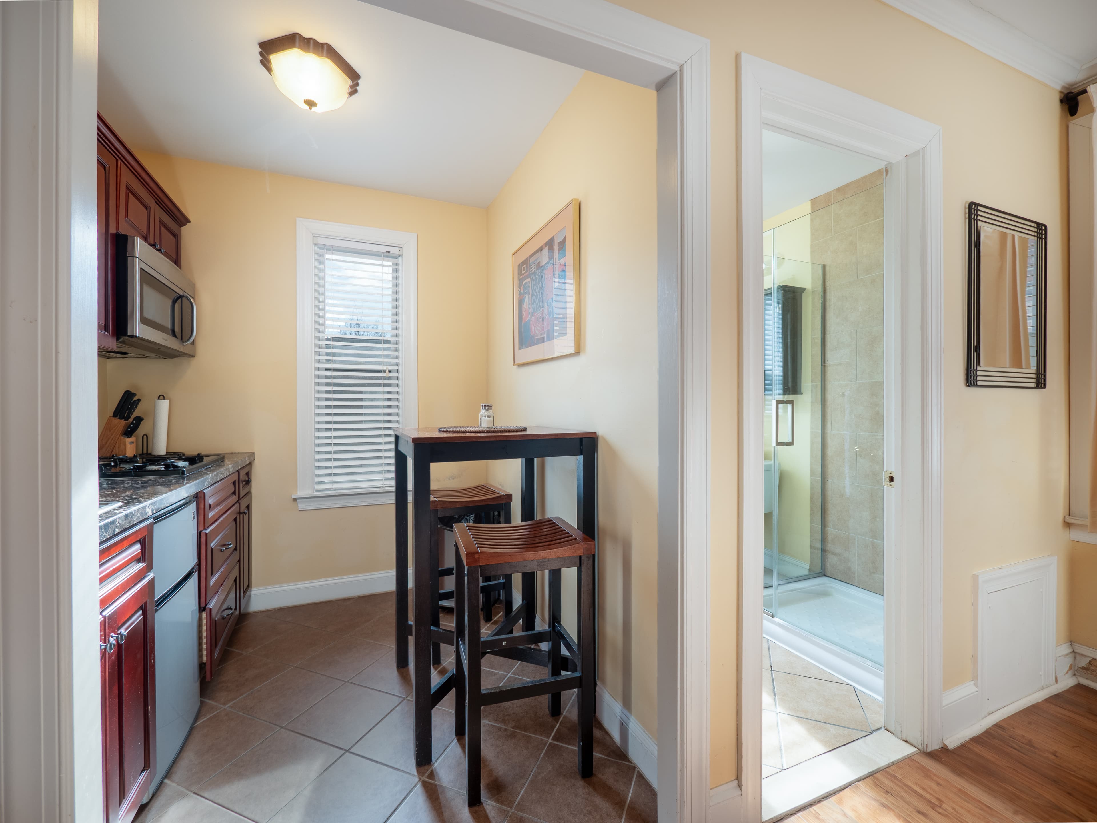 Kitchenette with view of the bathroom entrance to the right.