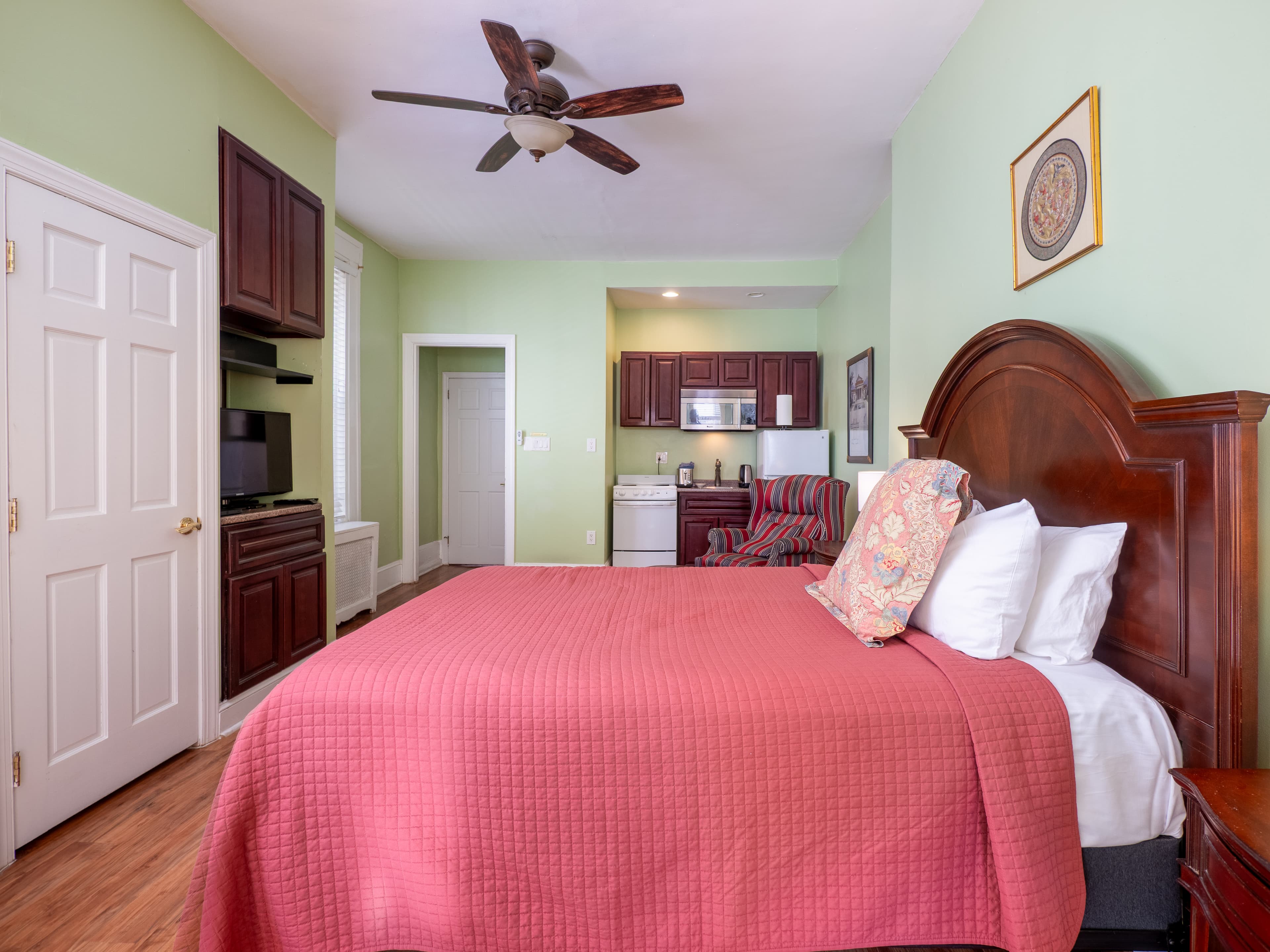 Closeup of the bed facing the entrance and kitchenette.